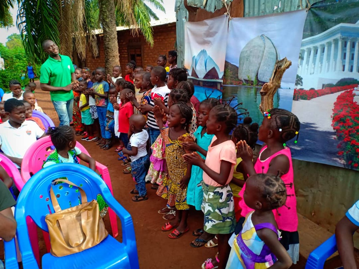 Friends and families in Bangui, Central African Republic, gather to commemorate the birth of the Bab.