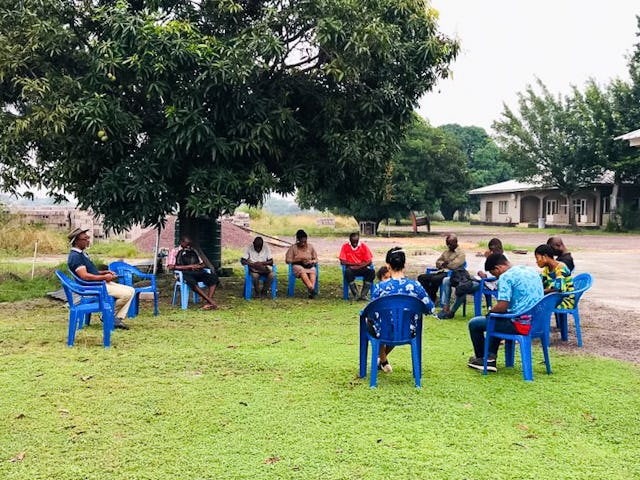 People of various faiths from the local area and from across the country who assist with the upkeep of the site for the national Baha’i House of Worship in the Democratic Republic of the Congo gather at the start of each day to pray together.