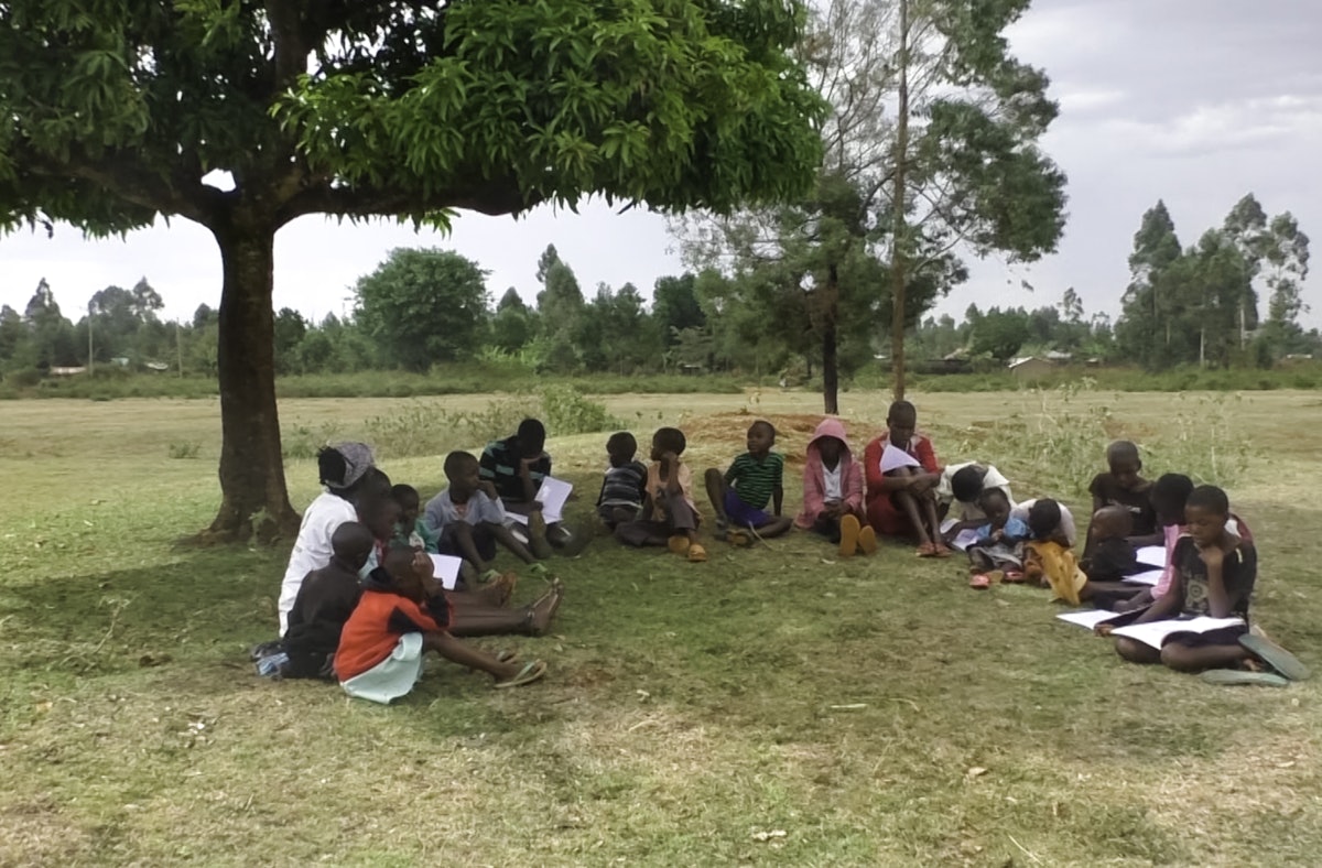 Photograph taken before the current global health crisis. People of all ages participating in the Kenyan Baha’i community’s education programs regularly gather on the grounds of the local Baha’i House of Worship in Matunda to study and consult together about how they can develop their capacity to offer service to their society.