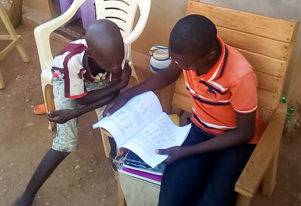 Students of a community school in Bangui, Central African Republic, study at home. “The approach of decentralized schools is opening unexpected doors,” says Mr. Mokolé. “This has given us the possibility to help parents increase their understanding of educational principles and skills, which is precious because the home is the primary locale for the education of children.”