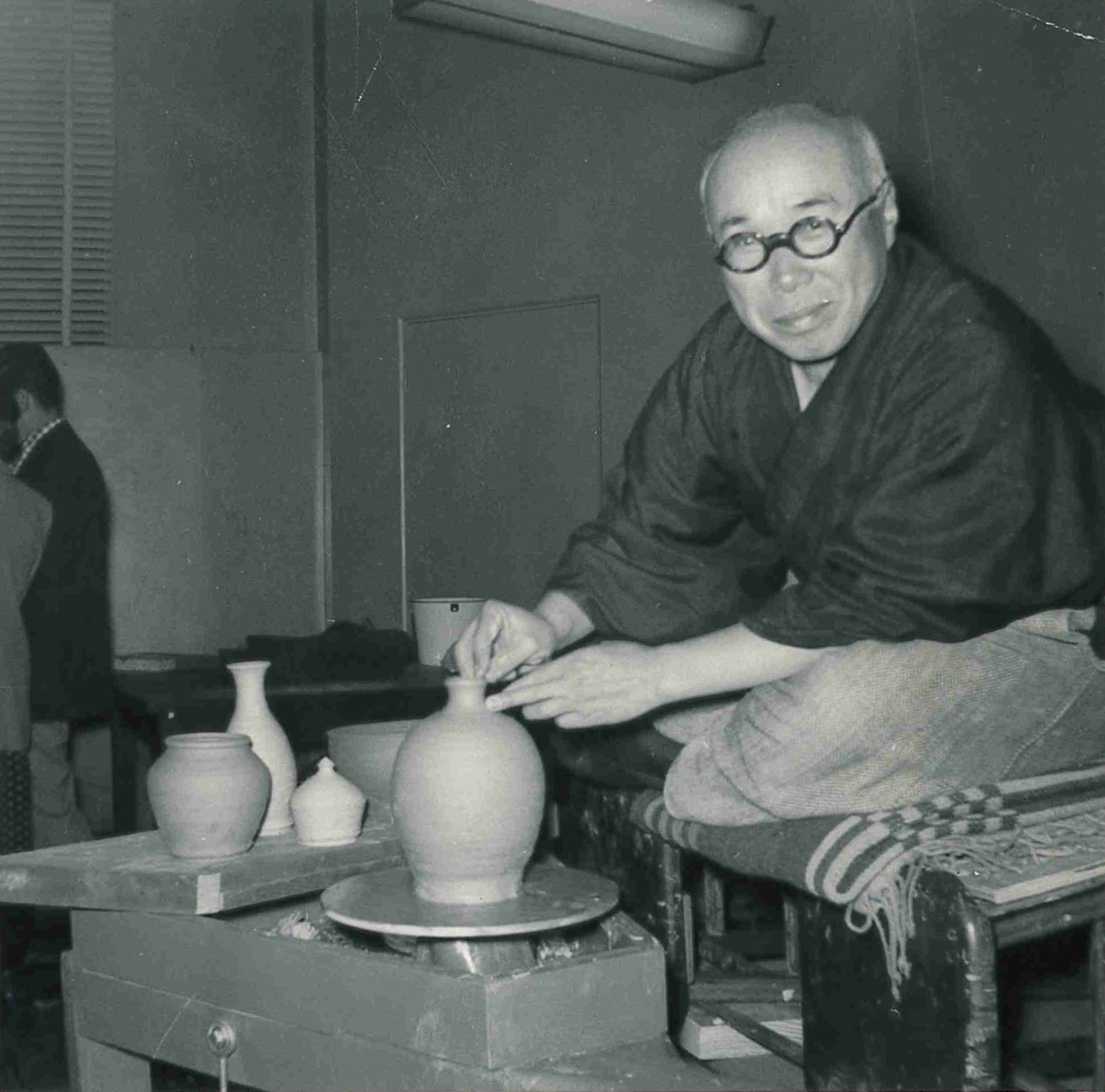 Shoji Hamada demonstrating throwing, 1953. From the Bernard Leach archive at the Crafts Study Centre, University for the Creative Arts, BHL/13300.