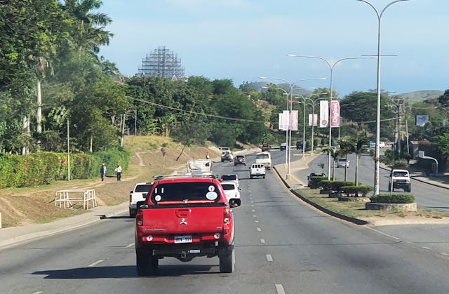 The rising structure of the Bahá’í House of Worship comes into view from all directions as one approaches the Waigani area of Port Moresby, Papua New Guinea.