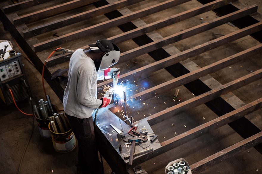 Special steel formwork has been made to give these walls their folded shape, which will blend with the intricate trellis overhead.