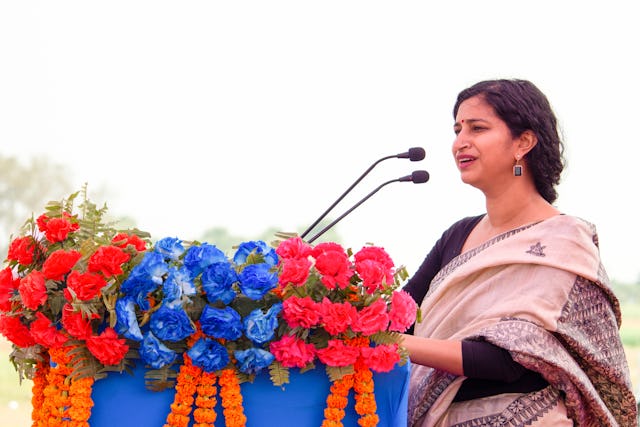 Amritha Ballal, one of the founding partners of SpaceMatters, the architecture firm that designed the House of Worship, speaks at the groundbreaking ceremony.