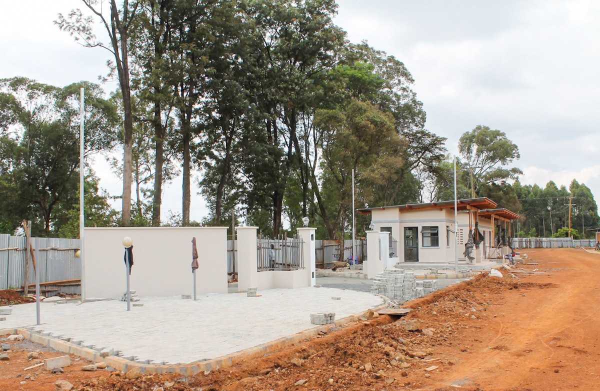 The main gate to the temple grounds nears completion.