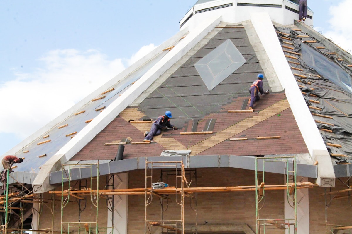 Skylights have been installed on all nine sides of the roof of the temple, and roof tiles are being placed, creating a diamond motif familiar to Kenyan culture.