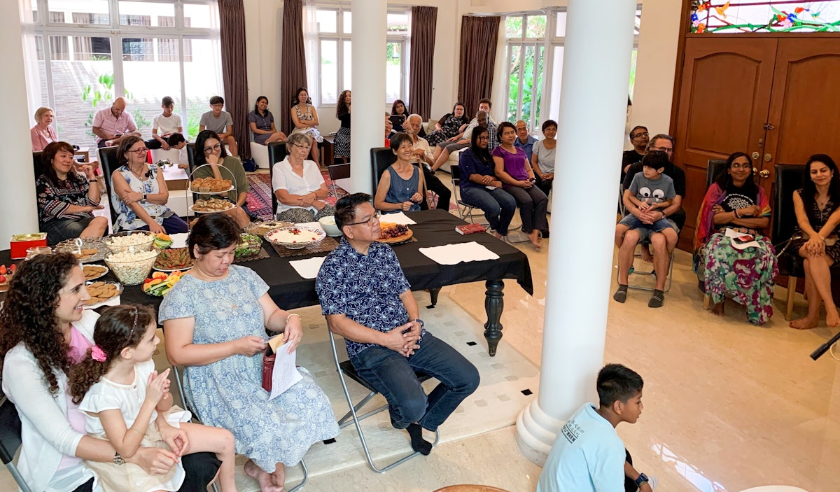 Photograph taken before the current health crisis. A Bahá’í Nineteen Day Feast held in Singapore in January 2020.
