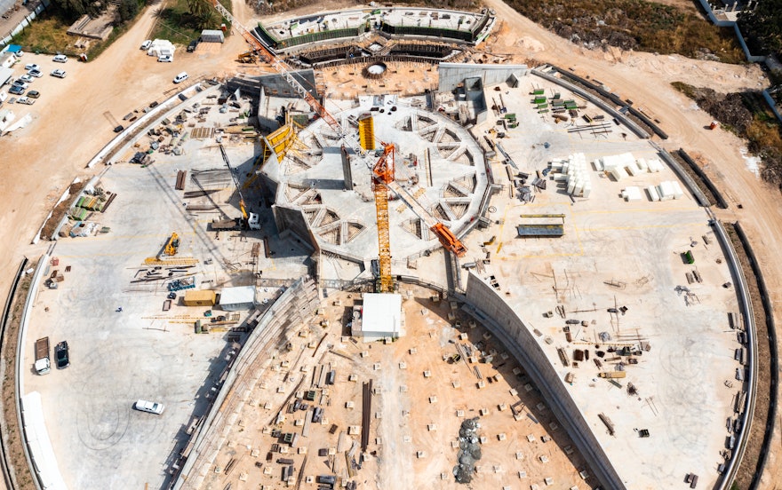 The four portal walls enclosing the north and south plazas have been completed, as seen in this view from the south.