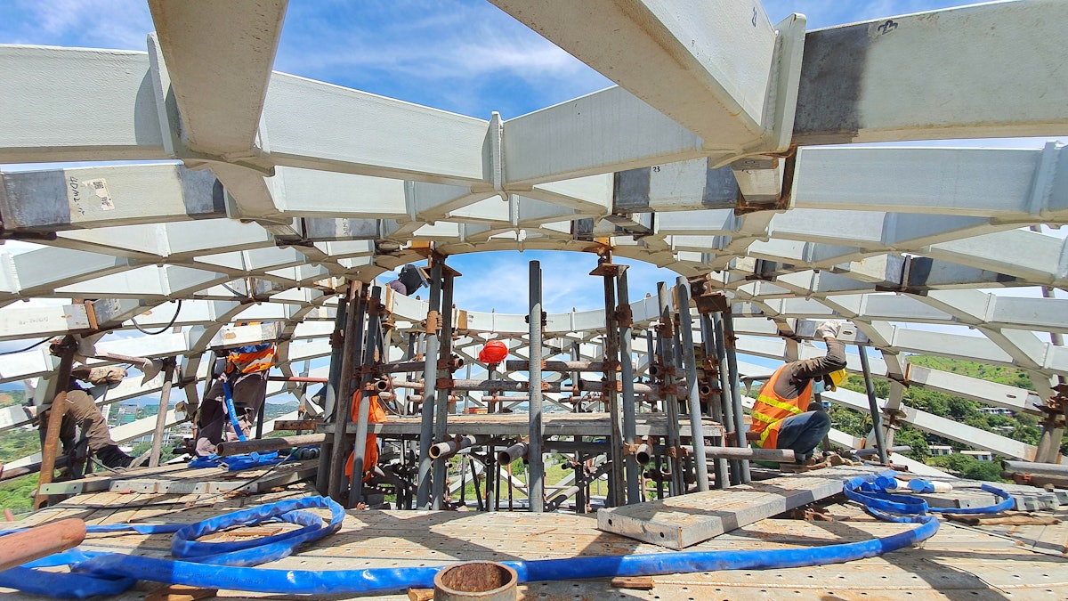 Steel mesh components of the compression ring come together at the apex of the dome of the House of Worship.