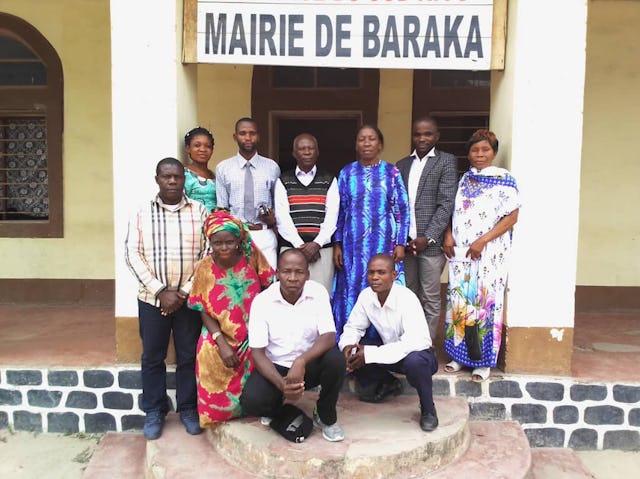 In-person gatherings held according to safety measures required by the government. The members of the Bahá’í Local Spiritual Assembly visiting the vice-mayor of Baraka, Emerite Tabisha (standing third from right).