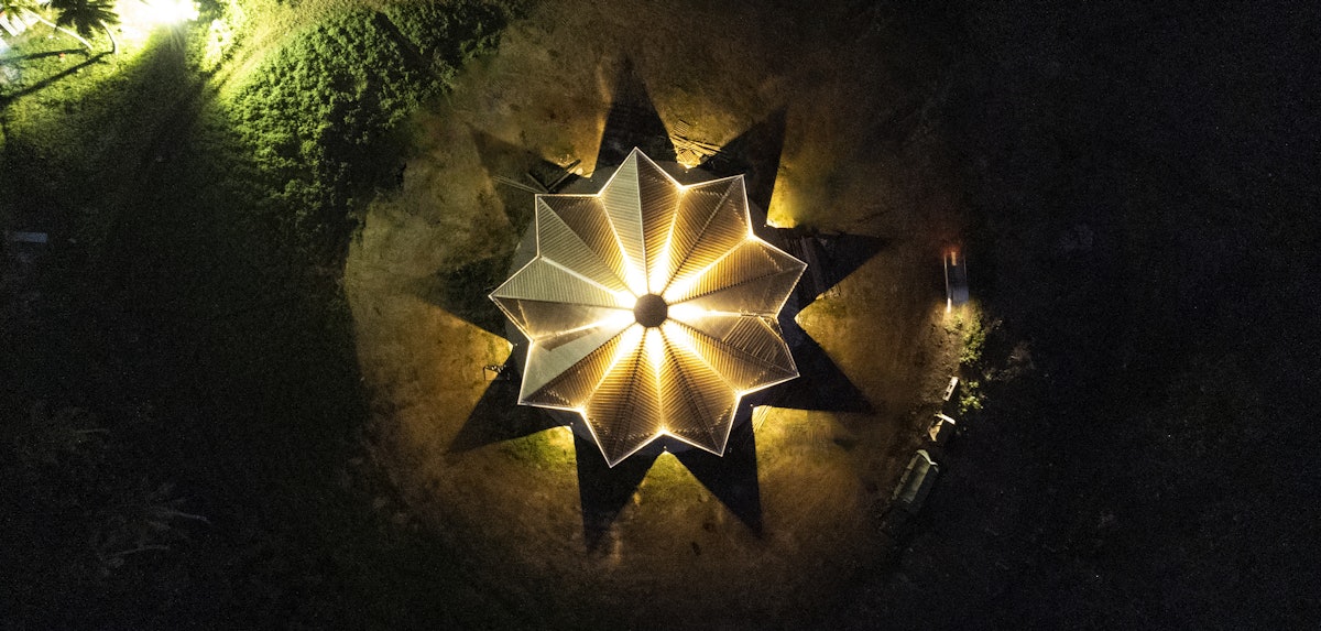 An aerial view of the temple structure at night.