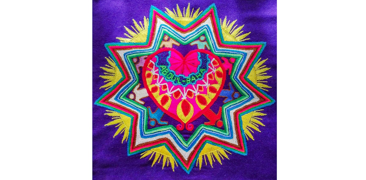 This mandala was embroidered by a Bolivian artist who was inspired by ‘Abdu’l-Bahá’s immense love for all of humanity.