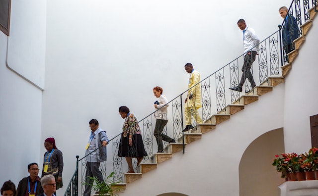 Attendees returning to the courtyard of the House of ‘Abbúd as their visit comes to an end.