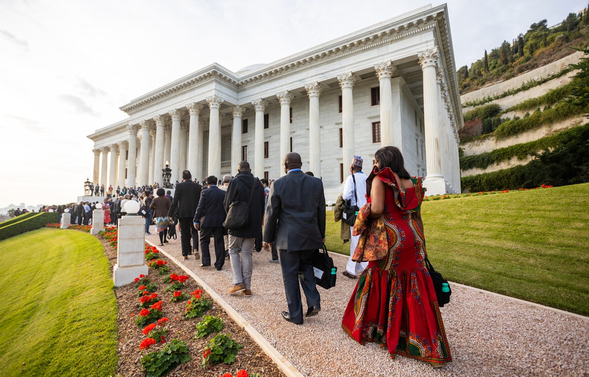 Participants gather at the Seat of the Universal House of Justice for the opening of the event marking the centenary commemoration of the ascension of ‘Abdu’l-Bahá in the Holy Land.