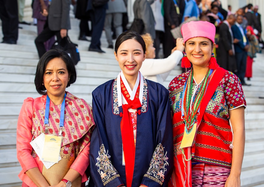 A group of attendees from different countries waiting with anticipation for the start of the program.