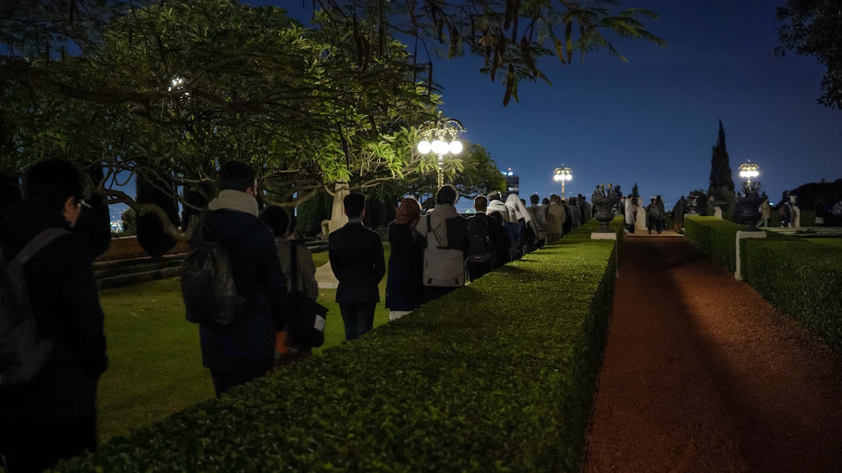 Another view of participants in the gardens of the Shrine of the Báb.