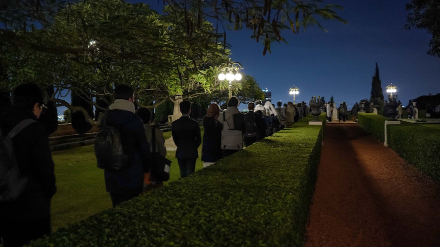 Another view of participants in the gardens of the Shrine of the Báb.