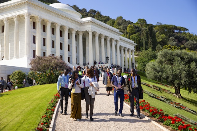 Participants leaving the Seat of the Universal House of Justice.