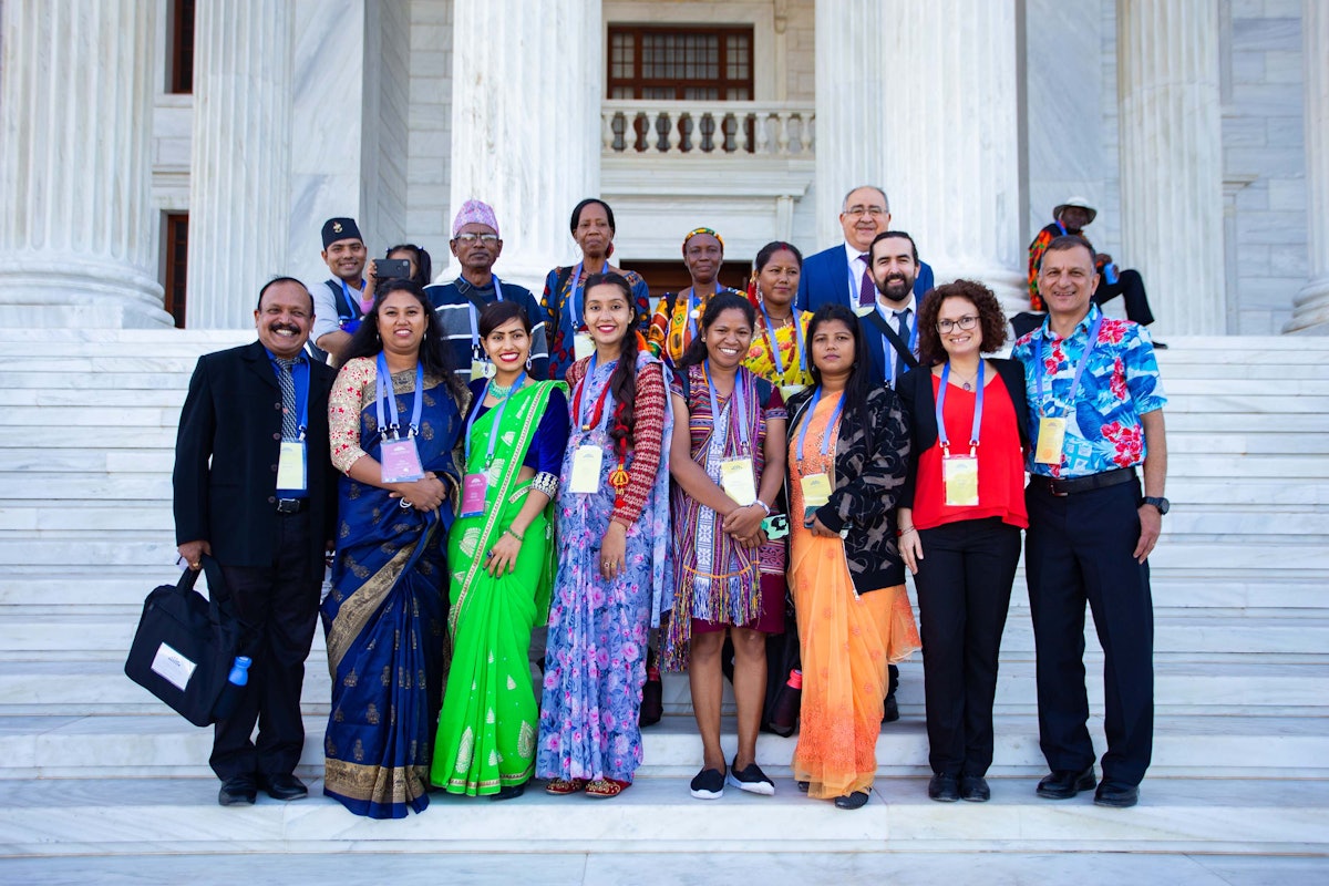 Participants from different countries on the steps of the Seat of the Universal House of Justice.