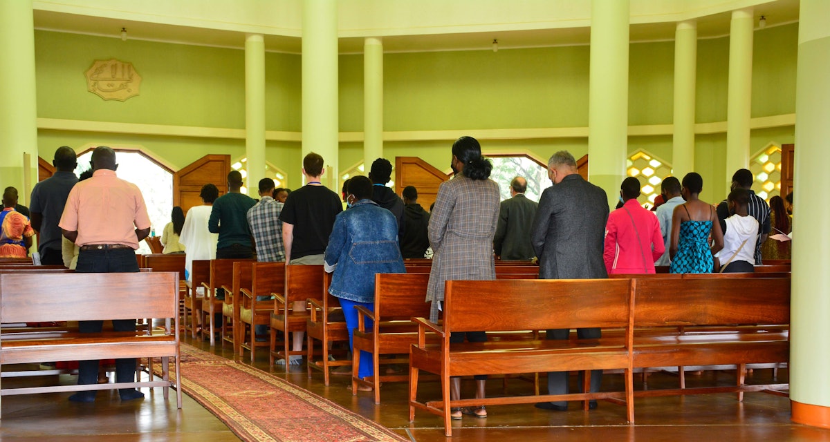 A view of attendees assembled inside the temple for the devotional program.