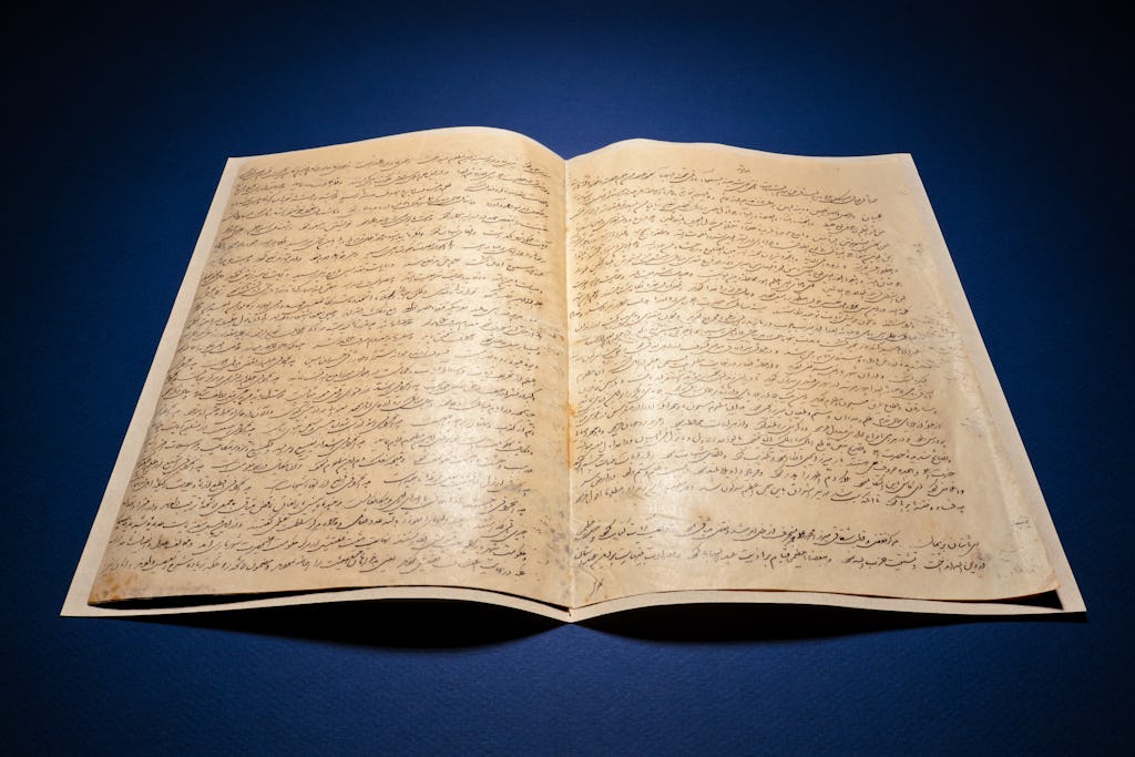 Image of the opening pages of ‘Abdu’l-Bahá’s Will and Testament