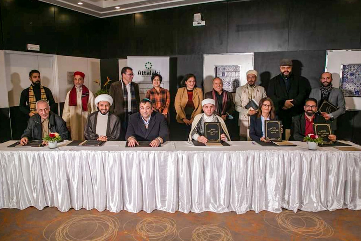 Representatives of religious communities gathered to sign a “National Pact for Coexistence,” including  (seated from left to right): Mohamed Ridha Belhassine of the Tunisian Bahá’í community, Ahmed Salman of the Shia Ahl Al-Bayt Foundation, Daniel Cohen, Rabbi of the La Goullette Synagogue, Hsan Ben Abdallah of the Sufi community, Ahlem Arfaoui of the Anglican Church, and Kamel Ouled Fatma of the Anglican Church.