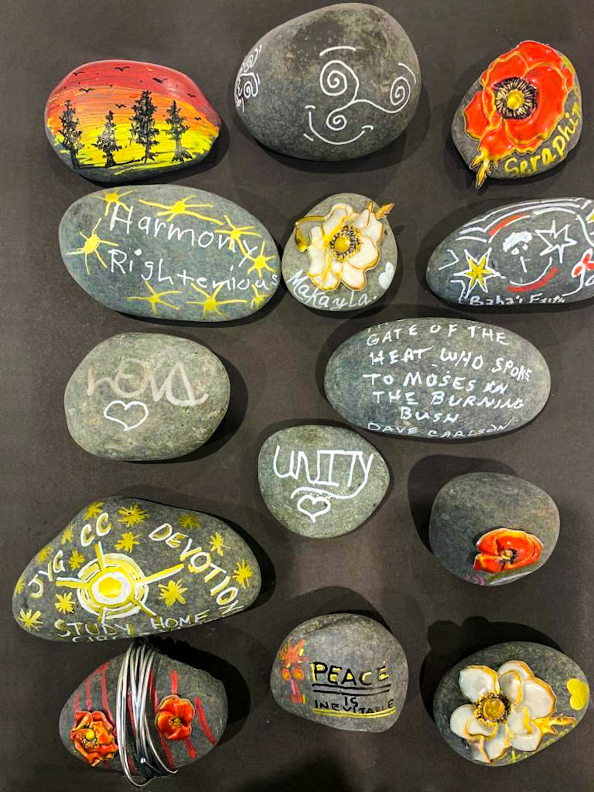 Participants at a conference in the United States decorated rocks with words of hope and floral designs inspired by the Baháʼí writings.