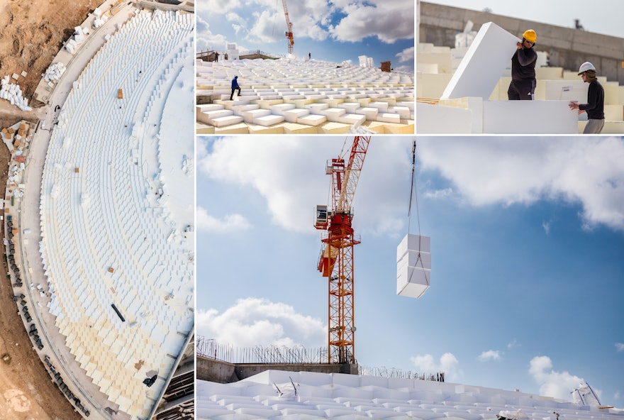 EPS formwork is lowered into place using a crane, giving the berm its initial shape.