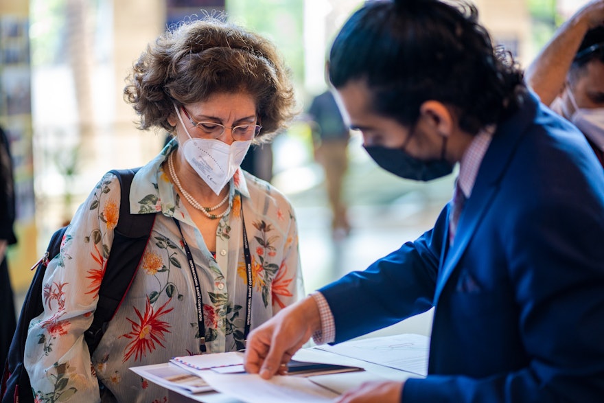 A delegate is being assisted while registering.