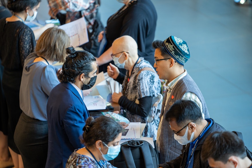 Some 1,400 delegates and guests register as they arrive at the convention center.