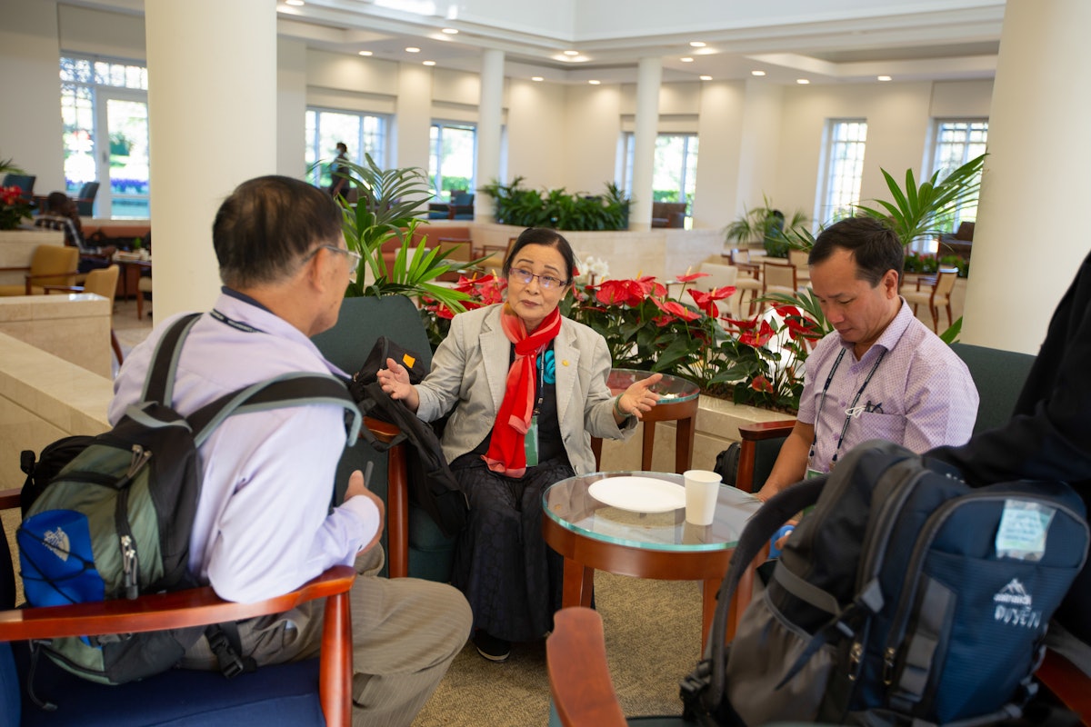 Delegates in the Báhji Visitor Center.