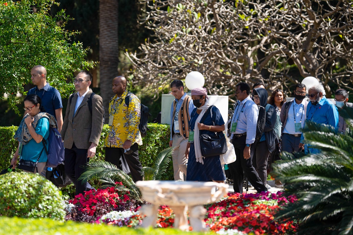 Delegates in the gardens surrounding the Shrine of the Báb.