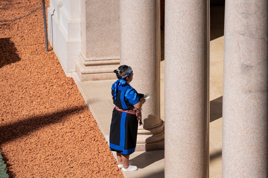 A delegate medidating outside the Shrine of the Báb.