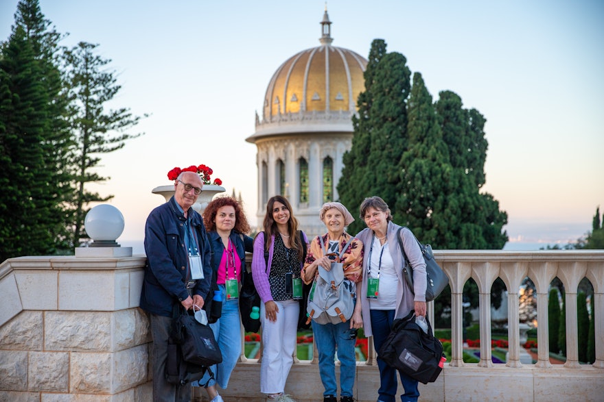 Delegates standing on the terrace above the Shrine of the Báb.