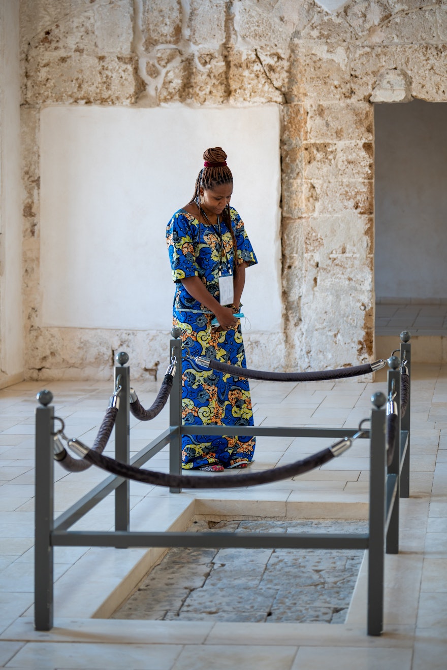 A delegate stops for a moment of prayer in the prison.