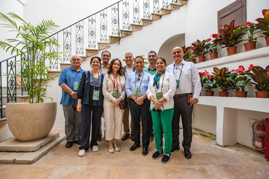 The members of the National Spiritual Assembly of the Bahá’ís of the United Arab Emirates at the House of ‘Abbúd.