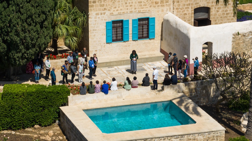 A group of delegates gather along a section of the historic aqueduct   that passed by the Mansion of Mazra‘ih.