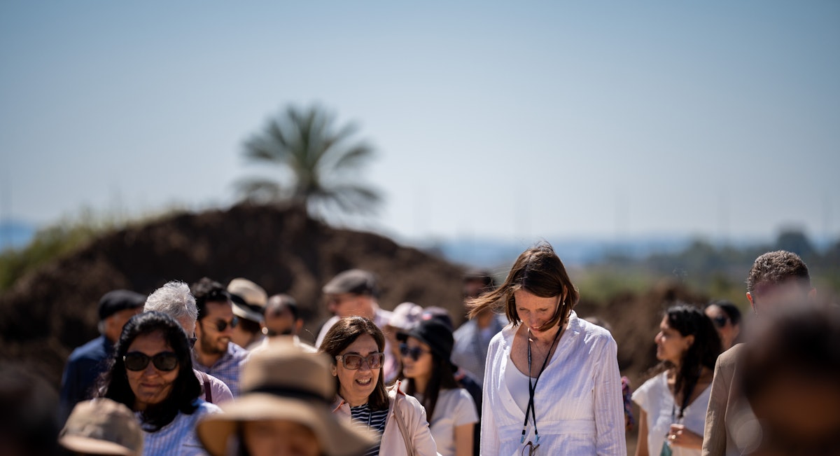 Delegates walk the grounds of the construction site of the Shrine of ʻAbdu'l-Bahá.
