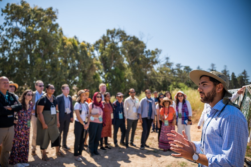 Delegates during their visit to the construction site of the Shrine of ʻAbdu'l-Bahá.