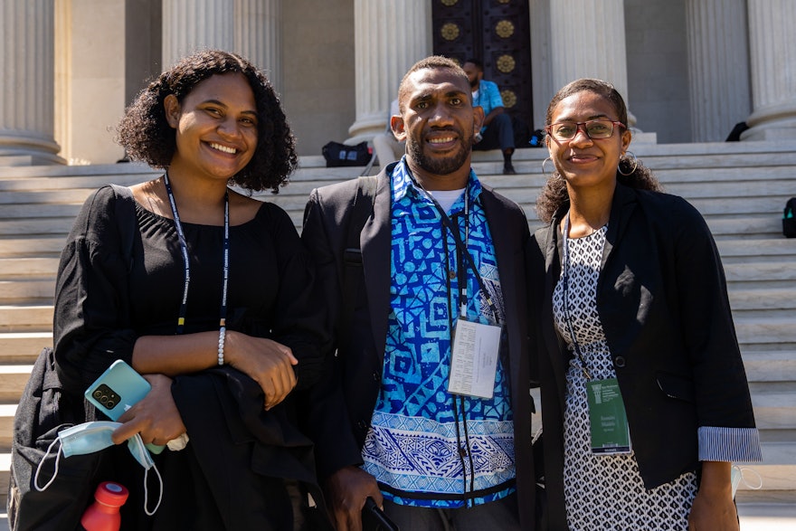 Delegates standing on the steps of the International Archive Building following their visit.