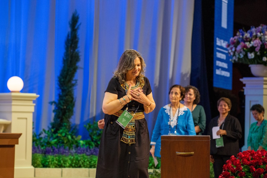 A delegate from Egypt casts her ballot for the election of the Universal House of Justice.