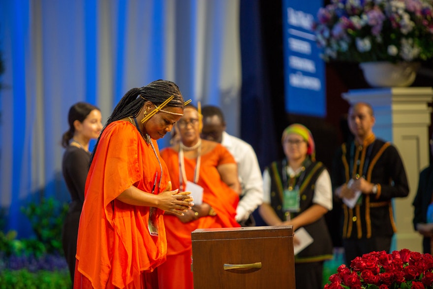 A delegate from Rwanda casts her ballot for the election of the Universal House of Justice.