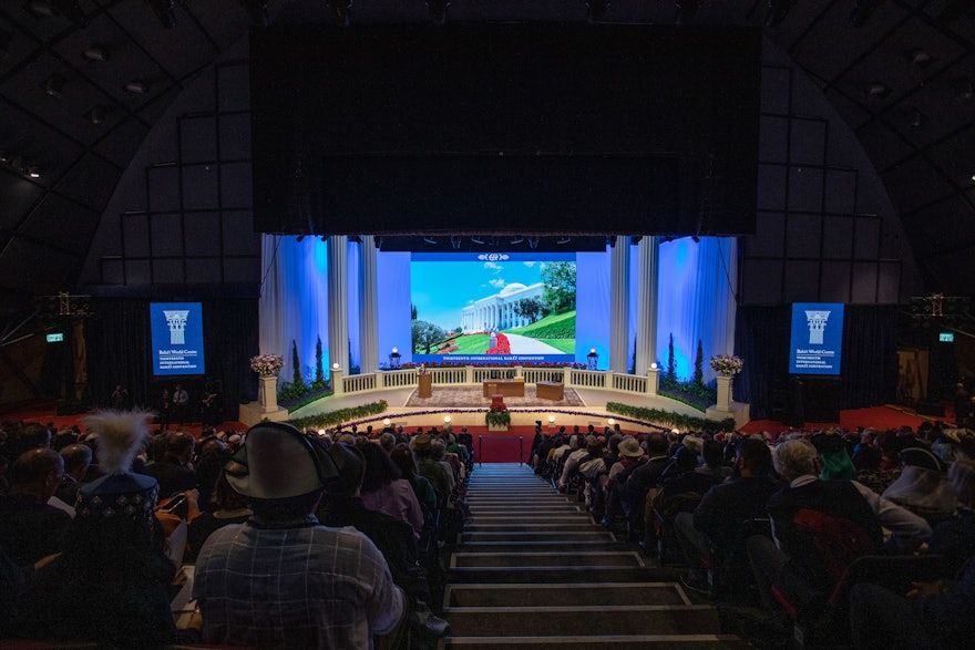 Delegates at the start of the 13th International Bahá’í Convention, before ballots are cast.