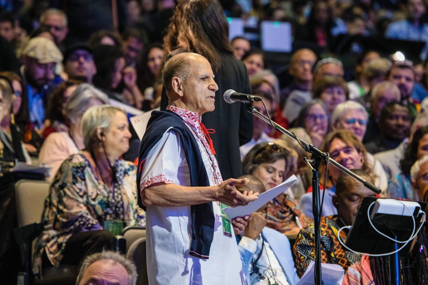 A delegate from Ukraine addresses fellow delegates at the 13th International Bahá’í Convention.