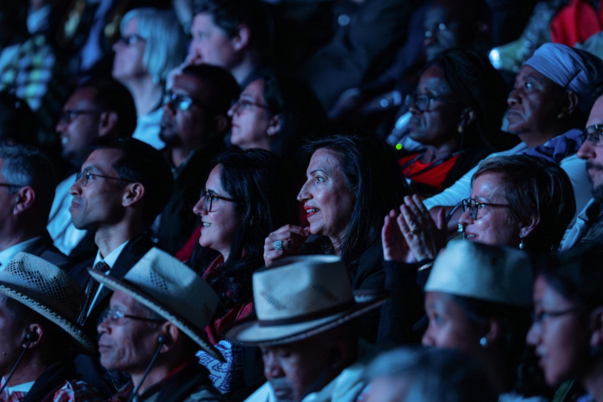 Convention participants watch An Expansive Prospect, a new film commissioned by the Universal House of Justice and released during the 13th International Bahá’í Convention.