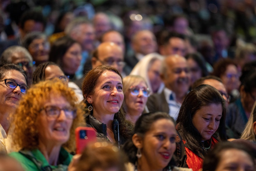 Convention participants listen to a delegate’s remarks during a consultative session.