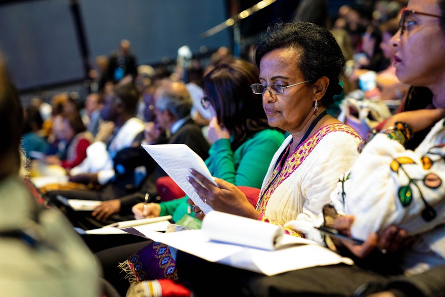 A delegate from Ethiopia reads the Riḍván message.