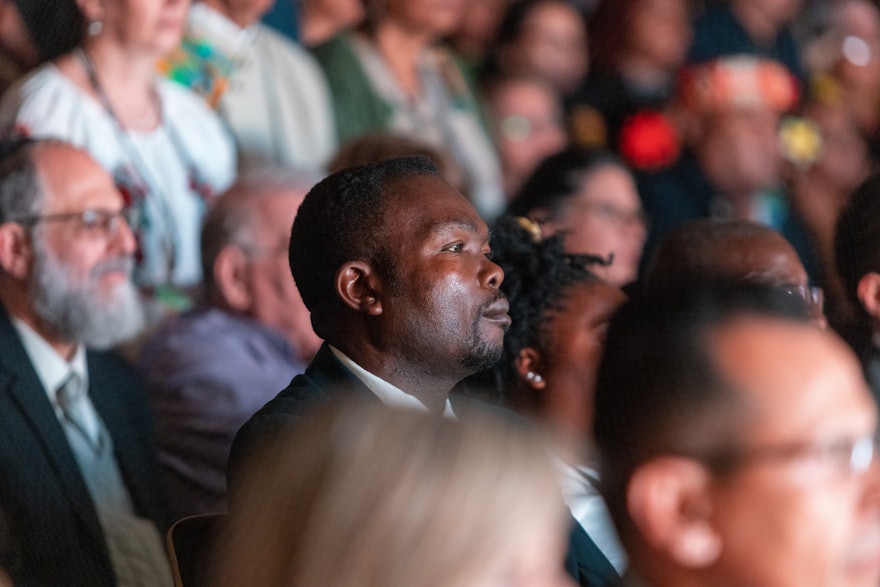 Participants listen to the opening remarks.