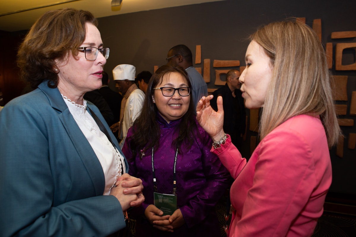 Haifa Mayor Einat Kalisch-Rotem in conversation with delegates to the International Bahá’í Convention from Mongolia (middle) and Kazakhstan (right).