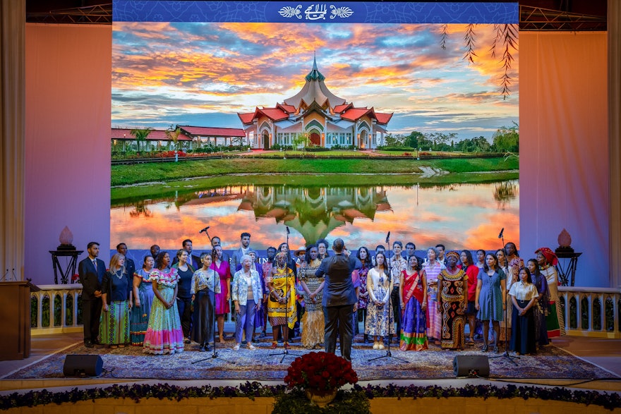 The 13th International Bahá’í Convention closed with a choral arrangement sung by a choir comprising staff of the Bahá’í World Centre.